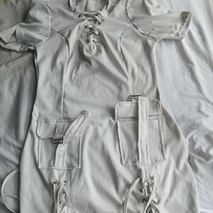 White short lace up bodycon dress with adjustable straps and pocket
